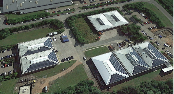 An aerial view of the Eurocaps factory, showing solar PV panels on 2 of their 3 buildings